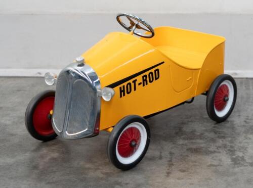 PEDAL CAR: A reproduction pedal car with 'Hot Rod' written on the side