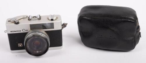 195 · KONICA: A Konica C35 35mm point and shoot film camera, with case
