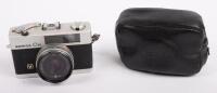 KONICA: A Konica C35 35mm point and shoot film camera, with case