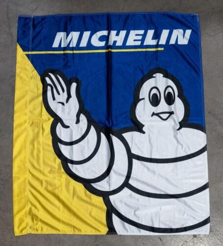 205 · MICHELIN: A cloth Michelin flag featuring Bibendum; banner with dimensions of 118cm wide, 136cm high overall.