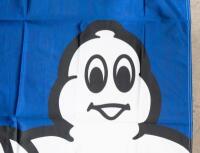 MICHELIN: A cloth Michelin flag featuring Bibendum; banner with dimensions of 118cm wide, 136cm high overall. - 2
