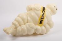 MICHELIN: A reproduction plastic seated Michelin Bibendum figure, approximately 45cm high