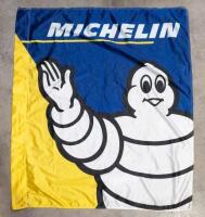 MICHELIN: A modern fabric Michelin dealers flag, featuring waving Bibendum, 135cm high, 117cm wide
