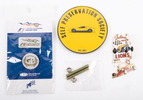 BADGES: A group of badges, including Indiana MD25 Lions 1995 Seoul, Australian Grand Prix 2005 lapel pin set, and a Self Preservation Society grille badge