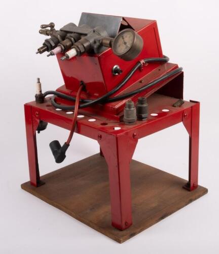 CHAMPION: A Champion Spark Plugs workshop testing and servicing unit, mounted to a timber base, 42cm high, 35cm wide overall