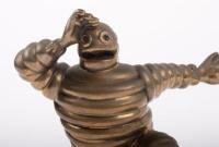 MICHELIN: A high quality reproduction brass Michelin Bibendum radiator mascot, approx 11.5cm high - 2