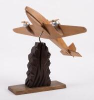 CARVED MODEL: An excellent Art Deco wooden carved model of a pre war twin engine aircraft, believed to be French c1920s-1940s, approximately 35cm high overall