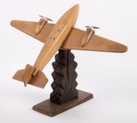 CARVED MODEL: An excellent Art Deco wooden carved model of a pre war twin engine aircraft, believed to be French c1920s-1940s, approximately 35cm high overall - 2