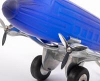 DC3 AIRPLANE LAMP: An Art Deco styled lamp in the form of a Douglas DC3 airplane, featuring interchangeable shades (Blue and Frosted White) believed to be a reproduction after the&nbsp;Sarsaparilla designs lamps. Measures approximately 34cm in length, 33cm wid - 5