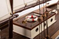 YACHT: A wooden model of an early sailing yacht with large fabric sails, approximately&nbsp;84cm in length, 83cm high, comes with a stand for base - 3