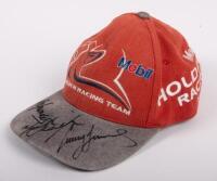 HRT: A Holden Racing Team autographed hat, bearing signatures of Mark Skaife and Craig Lowndes and one other