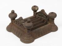 BOOT SCRAPER: A large 19th century Gothic Revival cast iron boot scraper