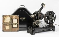 PROJECTOR: A c1920s Optica GMBH Heimkino 35mm hand operated projector, made in Bavaria Germany, complete with case and film titled 'In step with the times' - A Carl Dudley Production - New York - Beverly Hills'