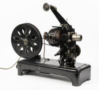PROJECTOR: A c1920s Optica GMBH Heimkino 35mm hand operated projector, made in Bavaria Germany, complete with case and film titled 'In step with the times' - A Carl Dudley Production - New York - Beverly Hills' - 3