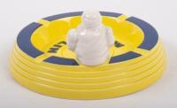 MICHELIN ASHTRAY: A circa 1990s / 2000s ceramic Michelin ashtray, yellow with blue trim, seated Bibendum figure to side, 16cm in diameter - 2