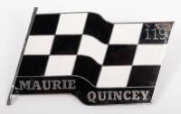 MAURIE QUINCEY: A chrome enamel Maurie Quincey 119 badge, chequered flag design, 6cm high, 10cm wide