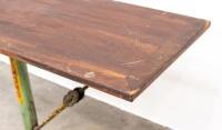 BED TABLE: An industrial style work/bed table on a cast iron base, featuring pipe wrench and chain support, mounted to small castor wheels, 93cm high, 120cm wide&nbsp;&nbsp; - 2