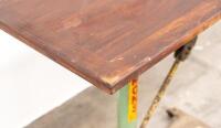 BED TABLE: An industrial style work/bed table on a cast iron base, featuring pipe wrench and chain support, mounted to small castor wheels, 93cm high, 120cm wide&nbsp;&nbsp; - 3