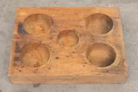 HAT MOULD: A solid timber mould, believed to be used for hat making, 58cm x 45cm
