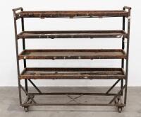 TROLLEY: A large steel framed trolley with timber shelving, 132cm high, 138cm wide, 38cm deep
