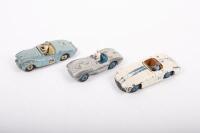 DINKY: A group of three Dinky Toys racing cars including No.107 Sunbeam Alpine, No.110 Aston Martin, and No.133 Cunningham C-5R