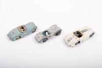 DINKY: A group of three Dinky Toys racing cars including No.107 Sunbeam Alpine, No.110 Aston Martin, and No.133 Cunningham C-5R - 2