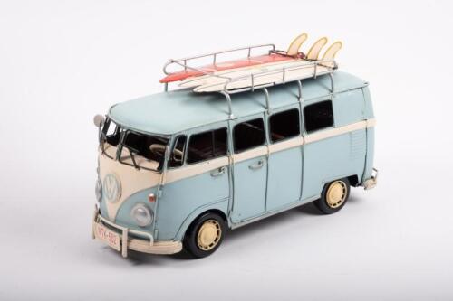 VOLKSWAGEN: A modern tin toy Volkswagen Kombi with surfboards the roof rack, approximately 31cm long