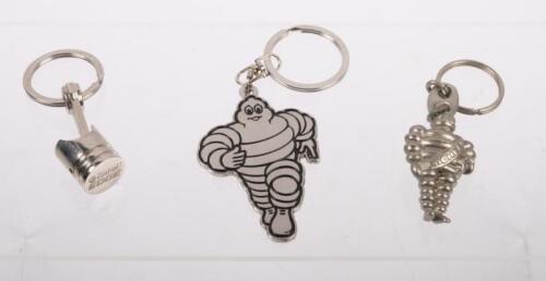 KEYRINGS: Three keyrings including two Michelin bibendum form keyrings and one Castrol 'Edge' keyring in form of a piston