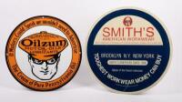 SIGNS: Two signs, including a reproduction enamel Oilzum Motor Oils round sign, and a Smith's American Workwear&nbsp;tin sign, largest measures 33cm in diameter