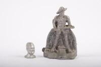 CAST FIGURES: Two cast aluminium figures, one of a WW2 soilder&nbsp;15cm high, the other a head of a figure believed to be Navy 5cm high