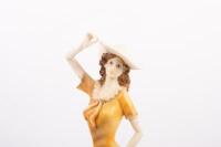 SCULPTURE: A resin sculpture of a lady on a bicycle, mounted to timber base, measures 38cm high - 2