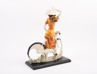 SCULPTURE: A resin sculpture of a lady on a bicycle, mounted to timber base, measures 38cm high - 3