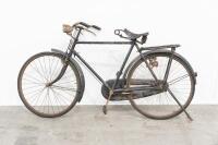 RALEIGH: An early, likely pre-war 28-inch Raleigh bicycle, fitted with a large leather spring seat
