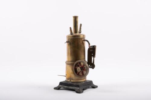STEAM ENGINE: An early vertical steam engine with a brass boiler, 22cm high, mounted to a cast base