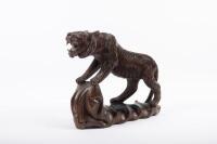 CARVING: An antique wood carving of a large cat, approximately 26cm high