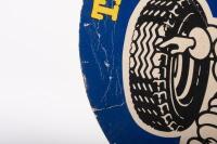 MICHELIN: A double sided round Michelin cardboard advertising sign featuring waving Bibendum&nbsp;to either side 'The tyre that has everything - Michelin' 36cm in diameter&nbsp; - 2