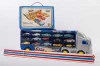 TOY CARS: A large group of toy cars, including a transporter containing various vehicles,&nbsp;along with a small carry case and sections of track pieces. Toy vehicles from brands such as Hot Wheels & Matchbox