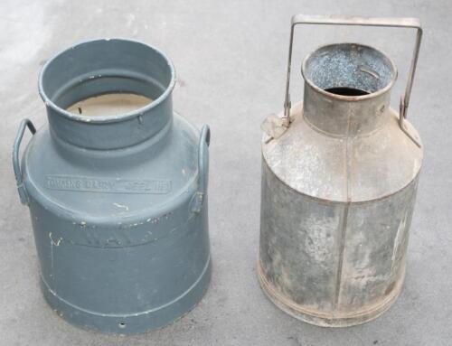 24A · JUGS: Two large jugs, including a four gallon galvanized jug with 'Supershell' tag and a Tomkins Diary Geelong milk jug, each approximately measure 48cm high