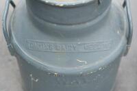 JUGS: Two large jugs, including a four gallon galvanized jug with 'Supershell' tag and a Tomkins Diary Geelong milk jug, each approximately measure 48cm high - 2