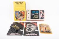 BOND: A group of James Bond related items, including two boxed card games, dress up gun holster, and hand cuffs