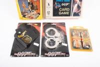 BOND: A group of James Bond related items, including two boxed card games, dress up gun holster, and hand cuffs - 2