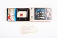 BOND: A group of James Bond related items, including two boxed card games, dress up gun holster, and hand cuffs - 5