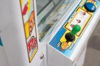 'Magic Point' prize machine, damaged, parts unit [Location: Dingley Village] - 10