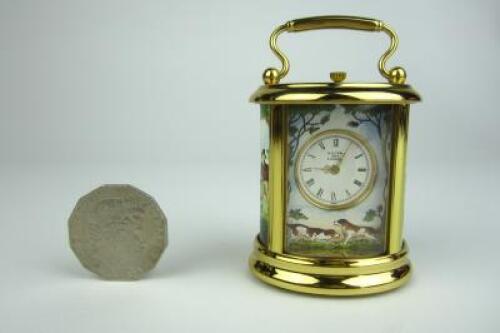 CARRAGE CLOCK: A minature Halcyon Days enamel brass cased carriage clock
