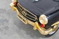 A modern metal bodied Mercedes-Benz 190 SL children's pedal car, approx 118cm long [Location: Melbourne] - 2