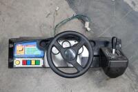 'Daytona&nbsp;USA'&nbsp;dashboard assembly, non&nbsp;original steering wheel, American gear shifter&nbsp;from an American Daytona&nbsp;cabinet [Location: Dingley Village]
