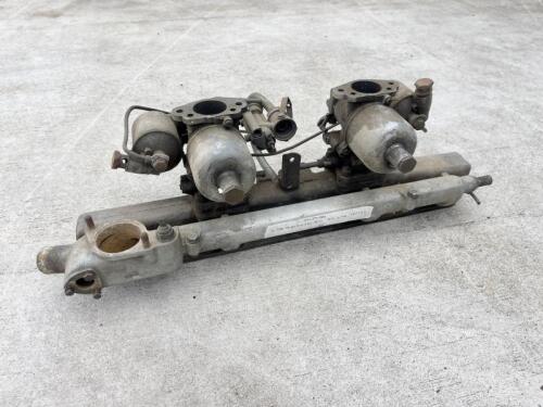 JAGUAR: A Jaguar Mark II inlet manifold with water rail and carburettors. [Location: Sydney]