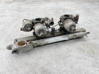 JAGUAR: A Jaguar Mark II inlet manifold with water rail and carburettors. [Location: Sydney]