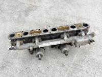 JAGUAR: A Jaguar Mark II inlet manifold with water rail and carburettors. [Location: Sydney] - 2