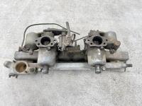 JAGUAR: A Jaguar Mark II inlet manifold with water rail and carburettors. [Location: Sydney] - 3